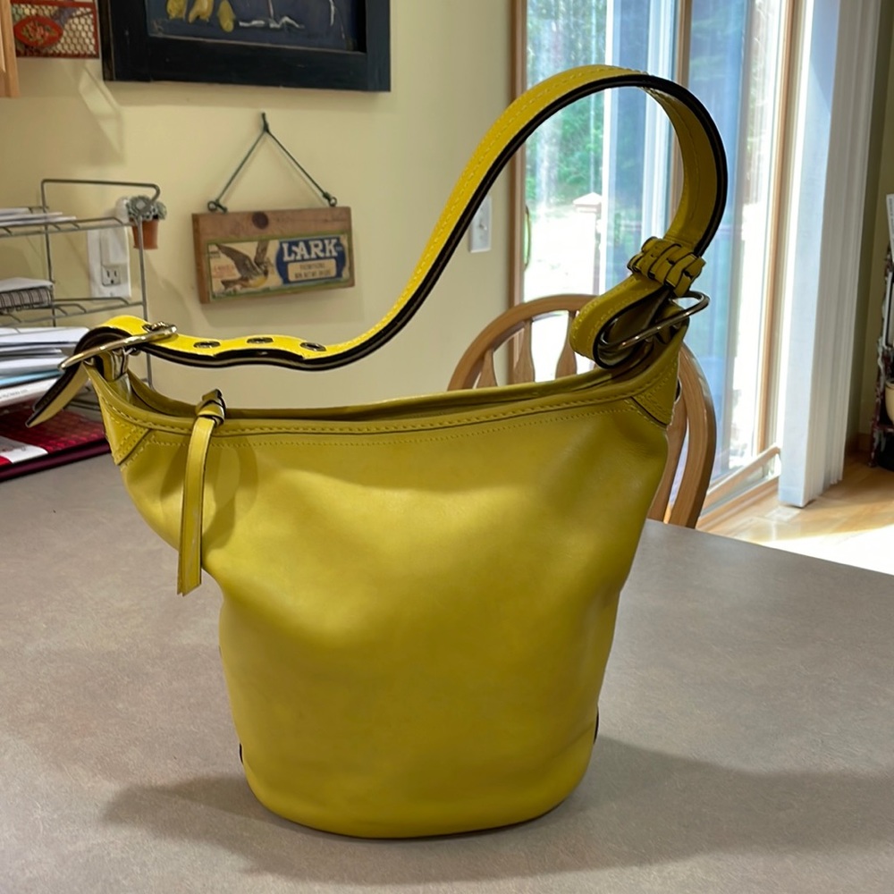 Beautiful Coach bag in fun yellow color. Great used condition.